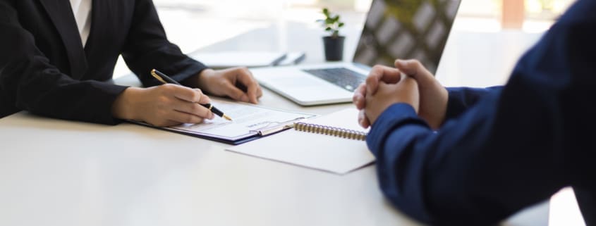 Broker explaining what Minimum Essential Coverage is to a business owner